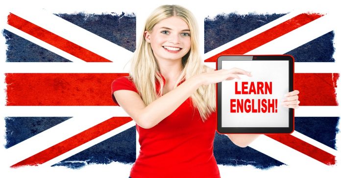 young woman holding tablet pc. english learning concept
